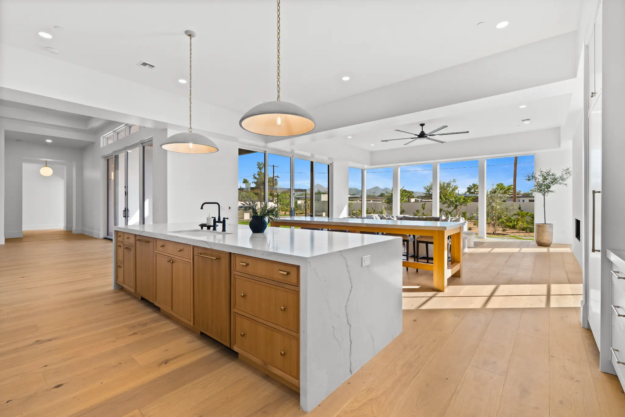 Chef's kitchen with stone island and mountain views